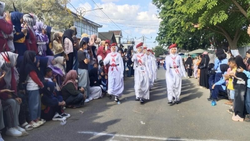 Derap Langkah SMA Muhammadiyah Arjasa Tampil Memukau, Merah Putih Membara di Gerak Jalan HUT RI ke-81